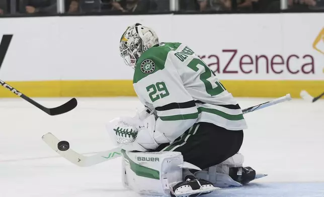 Dallas Stars goaltender Jake Oettinger (29) makes a save against the Vegas Golden Knights during the second period in Game 4 of an NHL hockey Stanley Cup first-round playoff series Monday, April 29, 2024, in Las Vegas. (AP Photo/Ian Maule)