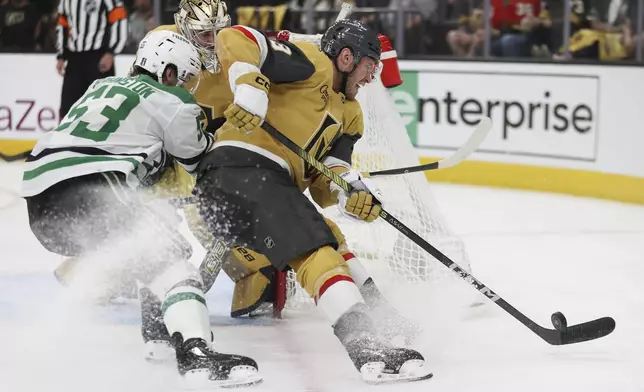 Vegas Golden Knights defenseman Brayden McNabb (3) skates past Dallas Stars center Wyatt Johnston (53) during the third period in Game 4 of an NHL hockey Stanley Cup first-round playoff series Monday, April 29, 2024, in Las Vegas. (AP Photo/Ian Maule)
