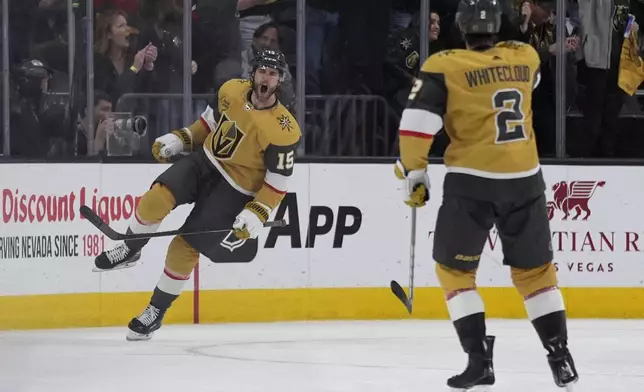 Vegas Golden Knights defenseman Noah Hanifin (15) celebrates after scoring against the Dallas Stars during the third period in Game 6 of an NHL hockey Stanley Cup first-round playoff series Friday, May 3, 2024, in Las Vegas. (AP Photo/John Locher)