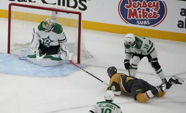 Dallas Stars goaltender Jake Oettinger (29) blocks a shot attempt by the Vegas Golden Knights during the first period in Game 6 of an NHL hockey Stanley Cup first-round playoff series Friday, May 3, 2024, in Las Vegas. (AP Photo/John Locher)