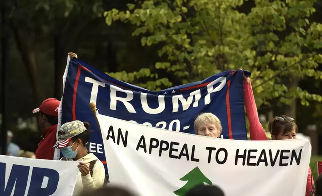 FILE - An Appeal To Heaven flag is pictured as people gather at Independence Mall to support President Donald Trump as he visits the National Constitution Center to participate in the ABC News town hall, Sept. 15, 2020, in Philadelphia. Supreme Court Justice Samuel Alito is embroiled in a second flag controversy, this time over the “Appeal to Heaven” flag, a banner that in recent years has come to symbolize Christian nationalism and the false claim that the 2020 presidential election was stolen. The flag was seen outside his New Jersey beach home last summer. (AP Photo/Michael Perez, File)