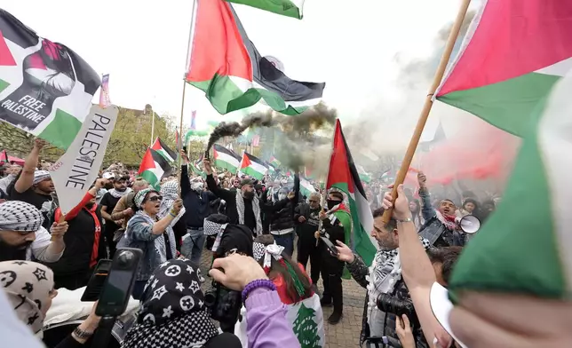 People wave Palestinian flags during a Pro-Palestinian demonstration for excluding Israel from Eurovision ahead of the second semi-final at the Eurovision Song Contest in Malmo, Sweden, Thursday, May 9, 2024. (AP Photo/Martin Meissner)