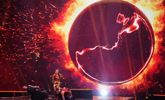 Nutsa Buzaladze of Georgia performing the song Firefighter during the dress rehearsal for the final at the Eurovision Song Contest in Malmo, Sweden, Friday, May 10, 2024. (AP Photo/Martin Meissner)