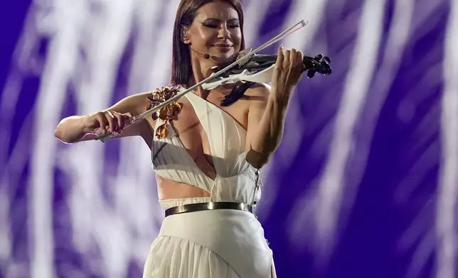 Natalia Barbu of Moldovia performs the song In The Middle during the first semi-final at the Eurovision Song Contest in Malmo, Sweden, Tuesday, May 7, 2024. (AP Photo/Martin Meissner)