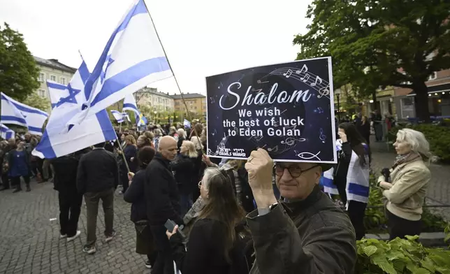 People carry Israeli flags during a pro-Israel demonstration to pay tribute to Israel's Eurovision participant Eden Golan in Malmö, Sweden, Thursday, May 9, 2024. In addition to the pro-Israel demonstration, Stop Israel also held a demonstration targeting Israel's participation in the 68th edition of the Eurovision Song Contest (ESC) in Malmö Arena. (Johan Nilsson/TT News Agency via AP)