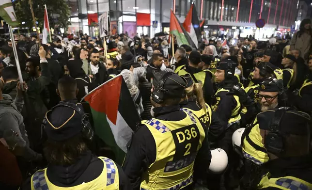 Police use pepper spray and fight back pro-Palestinian protesters in central Malmö, Sweden, during the 68th edition of the Eurovision Song Contest in Malmö Arena, Thursday, May 9, 2024. (Johan Nilsson/TT News Agency via AP)