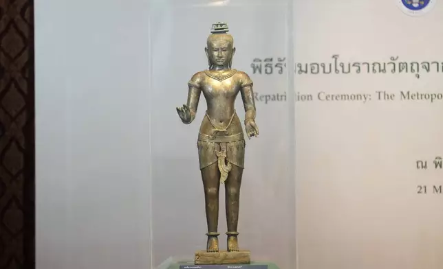 Standing Shiva sculpture from the 11th century is displayed during a repatriation ceremony at National Museum in Bangkok, Thailand, Tuesday, May 21, 2024. Thailand held a ceremony to mark the return of two stolen 1,000-year-old bronze sculptures. The ancient bronze sculptures were returned to Thailand by the Metropolitan Museum of Art in New York. (AP Photo/Sakchai Lalit)