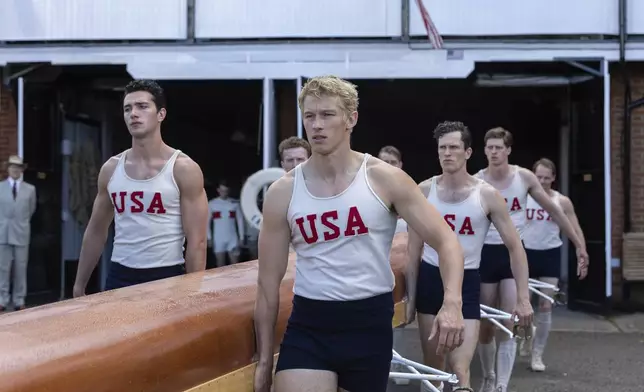 This image released by MGM Pictures shows Callum Turner, center, in a scene from "The Boys in the Boat." (Laurie Sparham/Metro-Goldwyn-Mayer Pictures via AP)