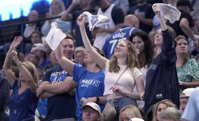 Fans cheer in the second half of Game 6 of an NBA basketball second-round playoff series between the Oklahoma City Thunder and Dallas Mavericks Saturday, May 18, 2024, in Dallas. (AP Photo/Tony Gutierrez)