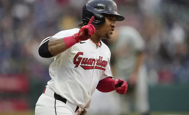 Cleveland Guardians' José Ramírez gestures as he runs to first base after hitting a home run in the sixth inning of a baseball game against the Detroit Tigers, Monday, May 6, 2024, in Cleveland. (AP Photo/Sue Ogrocki)