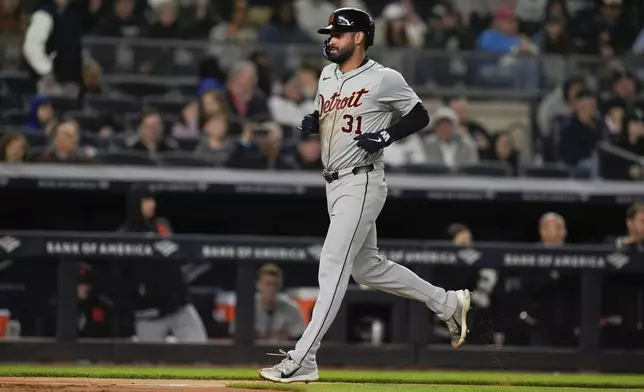 Detroit Tigers' Riley Greene (31) heads to home plate to score on a bases loaded walk of Colt Keith during the sixth inning of a baseball game against the New York Yankees, Friday, May 3, 2024, in New York. (AP Photo/Frank Franklin II)