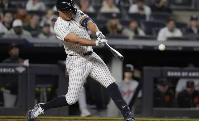 New York Yankees' Giancarlo Stanton hits an RBI double during the ninth inning of a baseball game against the Detroit Tigers, Friday, May 3, 2024, in New York. (AP Photo/Frank Franklin II)