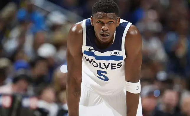 Minnesota Timberwolves guard Anthony Edwards looks on during a break in play in the first half of Game 1 of an NBA basketball second-round playoff series against the Denver Nuggets, Saturday, May 4, 2024, in Denver. (AP Photo/David Zalubowski)