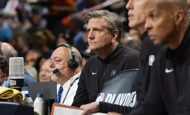 Minnesota Timberwolves head coach Chris Finch, center, looks on from the bench in the first half of Game 1 of an NBA basketball second-round playoff series against the Denver Nuggets, Saturday, May 4, 2024, in Denver. (AP Photo/David Zalubowski)