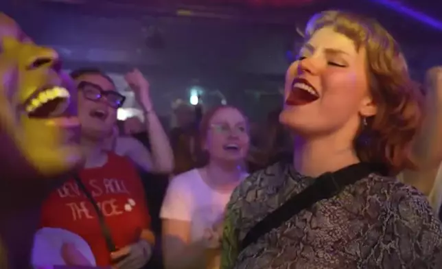In this image taken from video, Taylor Swift fans sing and dance at a nightclub event called 'Ready for It' that only plays Swift's music in Gothenburg, Sweden, on Tuesday, April 30th, 2024. Swift is scheduled to kick off the 18-city Europe leg of her record-setting Eras Tour on Thursday, May 9, 2024. There will be three shows in Stockholm. (AP Photo/Chisato Tanaka)