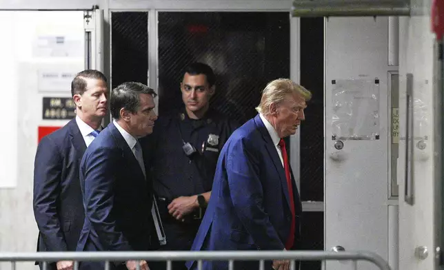 Former President Donald Trump, with attorney Todd Blanche, left, enter the courtroom at Manhattan criminal court in New York, Friday, Friday, May 10, 2024. (Curtis Means/DailyMail.com via AP, Pool)