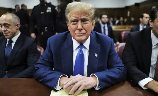 Former President Donald Trump appears at Manhattan criminal court before his trial in New York, Friday, May 3, 2024. (Charly Triballeau/Pool Photo via AP)