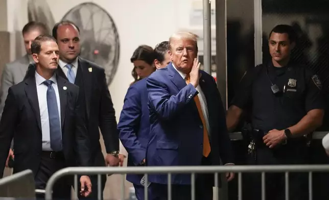 Former President Donald Trump speaks to reporters as he returns to the courtroom following an afternoon break in his trial, Tuesday, May 7, 2024, in New York. (AP Photo/Mary Altaffer, Pool)
