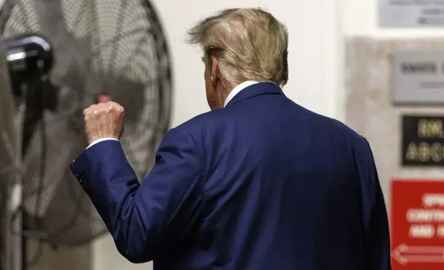 Former President Donald Trump gestures to reporters as he leaves the courtroom during a break in his trial, Tuesday, May 7, 2024 in New York. (Sarah Yenesel/Pool Photo via AP)