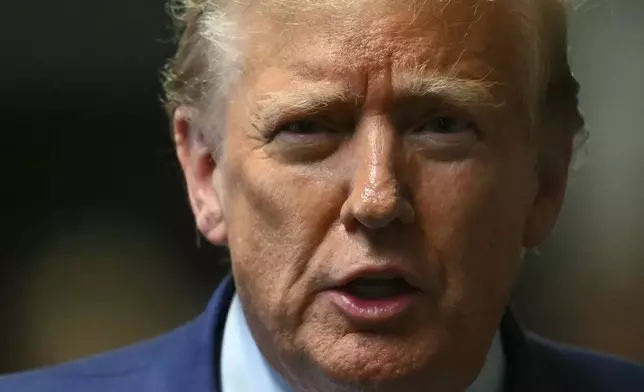 Former President Donald Trump speaks to the media at the end of the day of his hush money trial, in New York, Thursday, May 9, 2024. (Angela Weiss/Pool Photo via AP)