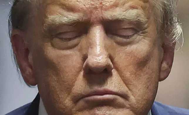 Former President Donald Trump closes his eyes, during his trial at Manhattan criminal court Thursday, May 16, 2024, in New York. (Mike Segar/Pool Photo via AP)