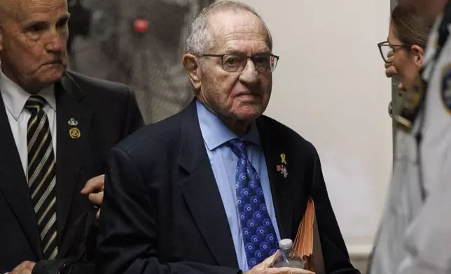 American lawyer Alan Dershowitz returns to the courtroom for the criminal trial of former President Donald Trump after a short break at the municipal criminal court in Monday May 20, 2024 in New York. (Sarah Yenesel/Pool Photo via AP)