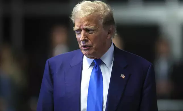 Former President Donald Trump speaks to media as he returns to his trial at the Manhattan Criminal Court, Friday, May 3, 2024, in New York. (Charly Triballeau/Pool Photo via AP)
