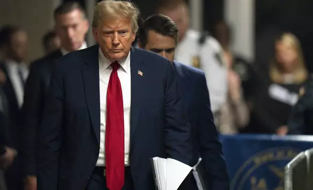 Former President Donald Trump walks over to addresses reporters following the day's proceedings in his trial at Manhattan criminal court in New York, Thursday, May 16, 2024. (Steven Hirsch/New York Post via AP, Pool)