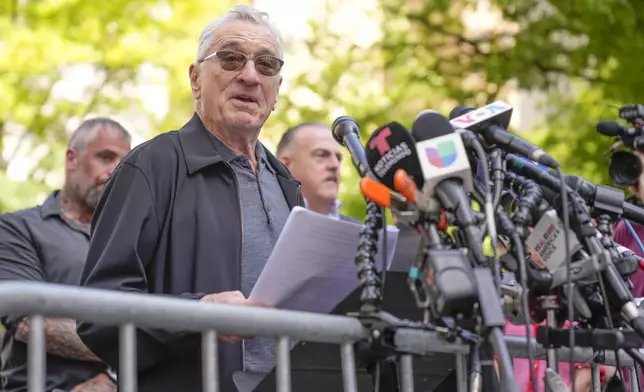 Robert De Niro speaks to reporters in support of President Joe Biden across the street from former President Donald Trump's criminal trial in New York, Tuesday, May 28, 2024. (AP Photo/Seth Wenig)