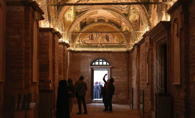 People visit a former Byzantine church which formally opened as a mosque, in Istanbul, Turkey, Monday, May 6, 2024. Turkish President Recep Tayyip Erdogan formally opened a former Byzantine church in Istanbul as a mosque on Monday, four years after his government had designated it a Muslim house of prayer, despite criticism from neighboring Greece. (AP Photo/Emrah Gurel)
