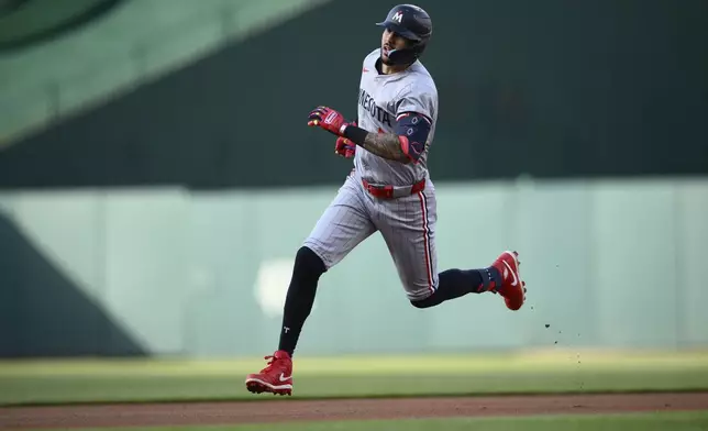 Minnesota Twins' Carlos Correa runs to third on his triple against the Washington Nationals during the first inning of a baseball game Tuesday, May 21, 2024, in Washington. (AP Photo/Nick Wass)