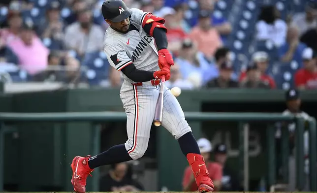 Minnesota Twins' Byron Buxton hits a home run against the Washington Nationals during the second inning of a baseball game Tuesday, May 21, 2024, in Washington. (AP Photo/Nick Wass)