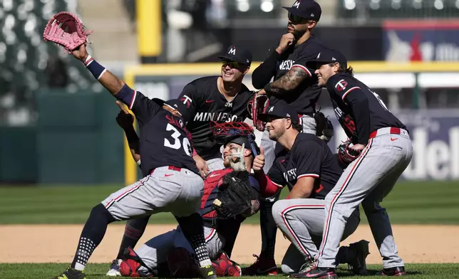 Minnesota Twins players celebrate after the Twins defeated the Chicago White Sox 10-5 in a baseball game in Chicago, Wednesday, May 1, 2024. (AP Photo/Nam Y. Huh)