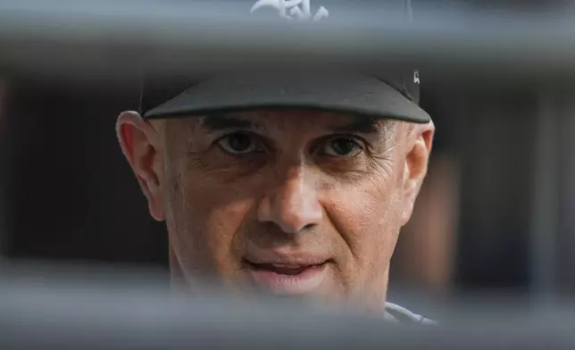 Chicago White Sox manager Pedro Grifol stands in the dugout during the first inning of a baseball game against the Minnesota Twins Tuesday, April 30, 2024, in Chicago. (AP Photo/Erin Hooley)