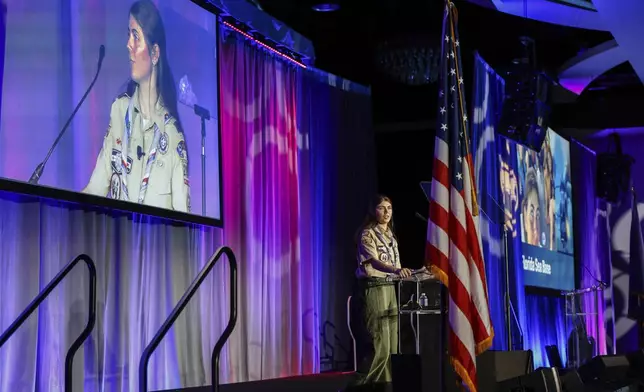 Selby Chipman, 20-year-old, speaks to the Boys Scouts of America annual meeting in Orlando, Fla., Tuesday, May 7, 2024. Chipman, a student at the University of Missouri, is an inaugural female Eagle Scout and the Assistant Scoutmaster for an all girls troop 8219 in Oak Ridge, N.C. The Boy Scouts of America is changing its name for the first time in its 114-year history and will become Scouting America. (AP Photo/Kevin Kolczynski)