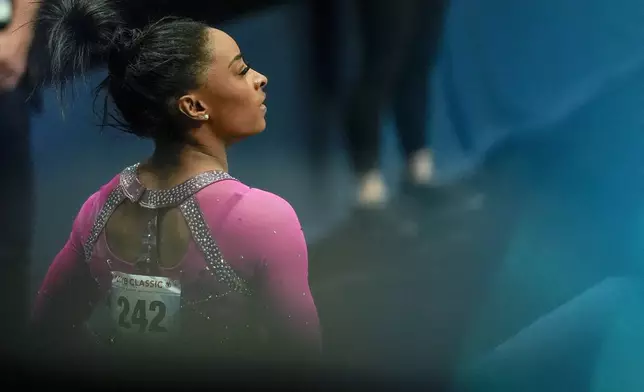 Simone Biles watches the scoreboard during the U.S. Classic gymnastics event Saturday, May 18, 2024, in Hartford, Conn. (AP Photo/Bryan Woolston)