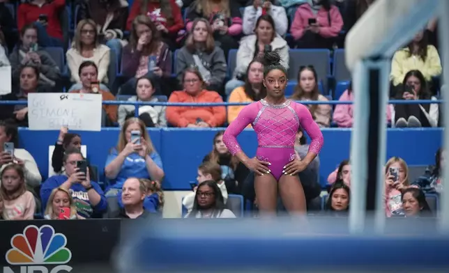 Simone Biles prepares to compete on the balance beam during the U.S. Classic gymnastics event Saturday, May 18, 2024, in Hartford, Conn. (AP Photo/Bryan Woolston)