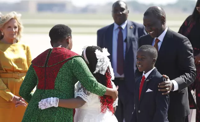 Kenya's President William Ruto, right, and first lady Rachel Ruto, second from left, arrive as first Lady Jill Biden, left, looks on at Andrews Air Force Base, Md., Wednesday, May 22, 2024, for a state visit to the United States. (AP Photo/Luis M. Alvarez)