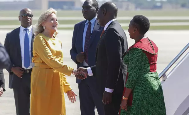 First lady Jill Biden, center, greets Kenya's President William Ruto and first lady Rachel Ruto, at right in green, as they arrive at Andrews Air Force Base, Md., Wednesday, May 22, 2024, for a state visit to the United States. (AP Photo/Luis M. Alvarez)
