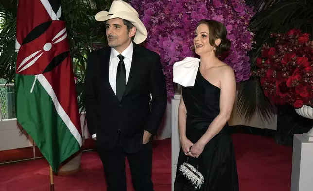 Brad and Kimberly Williams Paisley arrive at the Booksellers area of the White House for the State Dinner hosted by President Joe Biden and first lady Jill Biden for Kenya's President William Ruto and Kenya's first lady Rachel Ruto, Thursday, May 23, 2024, in Washington. (AP Photo/Jacquelyn Martin)