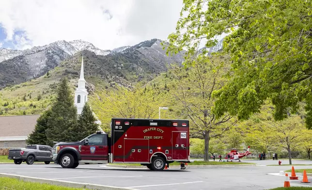An ambulance pulls away from Hidden Valley Park in Sandy, Utah, after emergency crews responded to a report of an avalanche and three missing skiers in Little Cottonwood Canyon on Thursday, May 9, 2024. (Isaac Hale/The Deseret News via AP)