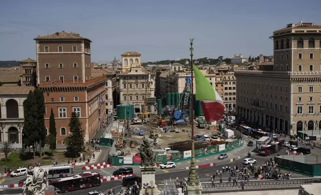 General view of the construction site of a major underground hub in central Piazza Venezia in Rome, Thursday, May 9, 2024. The Vatican crosses a key milestone Thursday in the runup to its 2025 Jubilee with the promulgation of the official decree establishing the Holy Year. For the next four years at least, central Piazza Venezia and its Imperial Forum-flanked boulevard to the Colosseum are scheduled to be congested and blighted by giant, 14-meter (yard) high green silos that are needed for the subway drilling operation under way. (AP Photo/Alessandra Tarantino)