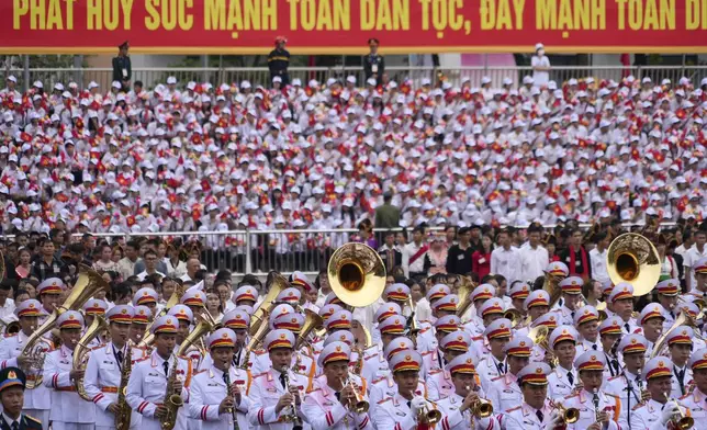 Soldiers participate in a parade commemorating the victory of Dien Bien Phu battle in Dien Bien Phu, Vietnam, Tuesday, May 7, 2024. Vietnam is celebrating the 70th anniversary of the battle of Dien Bien Phu, where the French army was defeated by Vietnamese troops, ending the French colonial rule in Vietnam. (AP Photo/Hau Dinh)
