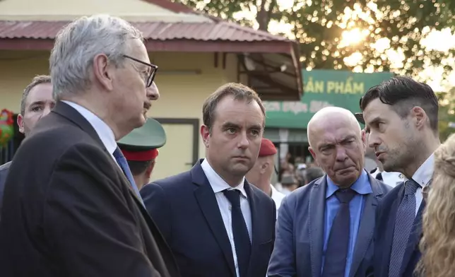 French Defense Minister Sebastien Lecornu listens as he visits a French wartime bunker preserved in Dien Bien Phu, Vietnam on Monday, May 6, 2024. Lecornu is in Vietnam to attend a ceremony to commemorate the 70th anniversary of the battle of Dien Bien Phu, where the French army was defeated by Vietnamese troops, ending French colonial rule in Vietnam. (AP Photo/Hau Dinh)
