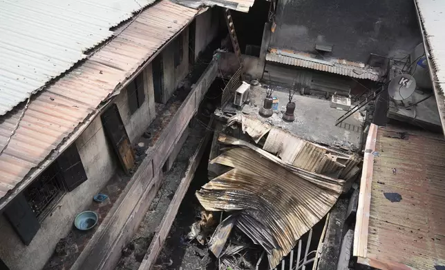 This photo shows the aftermath of a fire at small apartment building in Hanoi, Vietnam Friday, May 24, 2024. State media said the overnight fire has killed a number of people and injured several others. (AP Photo/Hau Dinh)