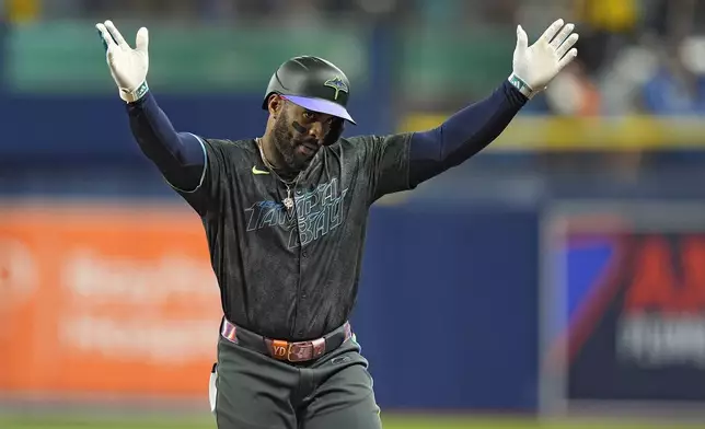 Tampa Bay Rays' Yandy Diaz celebrates his single off Chicago White Sox starting pitcher Chris Flexen during the fourth inning of a baseball game Wednesday, May 8, 2024, in St. Petersburg, Fla. (AP Photo/Chris O'Meara)