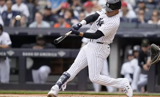 New York Yankees' Juan Soto hits a home run during the first inning of a baseball game against the Chicago White Sox, Saturday, May 18, 2024, in New York. (AP Photo/Frank Franklin II)