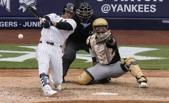 New York Yankees' Juan Soto hits a single during the eighth inning of a baseball game against the Chicago White Sox, Saturday, May 18, 2024, in New York. The Yankees won 6-1. (AP Photo/Frank Franklin II)