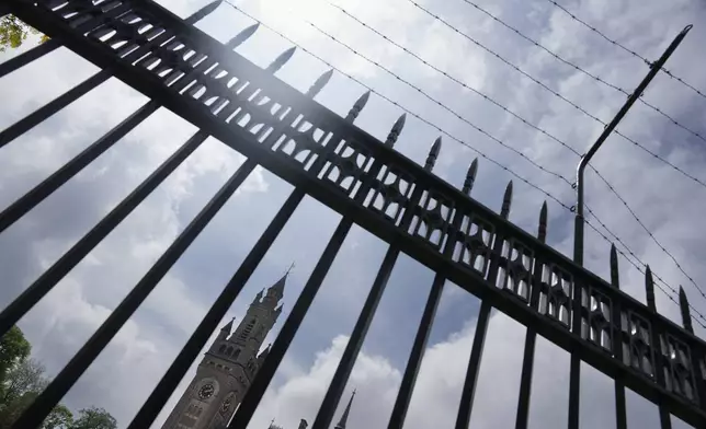 The Peace Palace, office of the International Court of Justice, or World Court, is pictured through a fence in The Hague, Netherlands, Thursday, May 16, 2024. The U.N.'s top court opened two days of hearings in a case brought by South Africa to see whether Israel needs to take additional measures to alleviate the suffering in war-ravaged Gaza. (AP Photo/Peter Dejong)