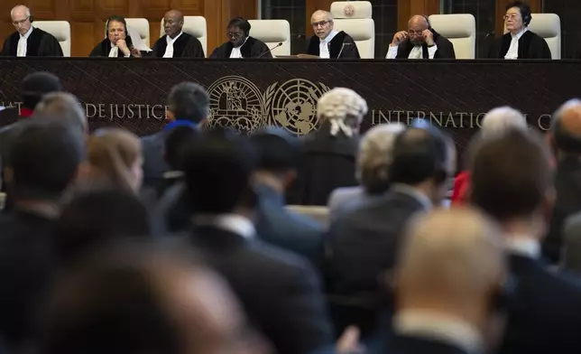 Presiding judge Nawaf Salam, third from right, opens the hearings at the International Court of Justice, in The Hague, Netherlands, Thursday, May 16, 2024. The U.N.'s top court opened two days of hearings in a case brought by South Africa to see whether Israel needs to take additional measures to alleviate the suffering in war-ravaged Gaza. (AP Photo/Peter Dejong)